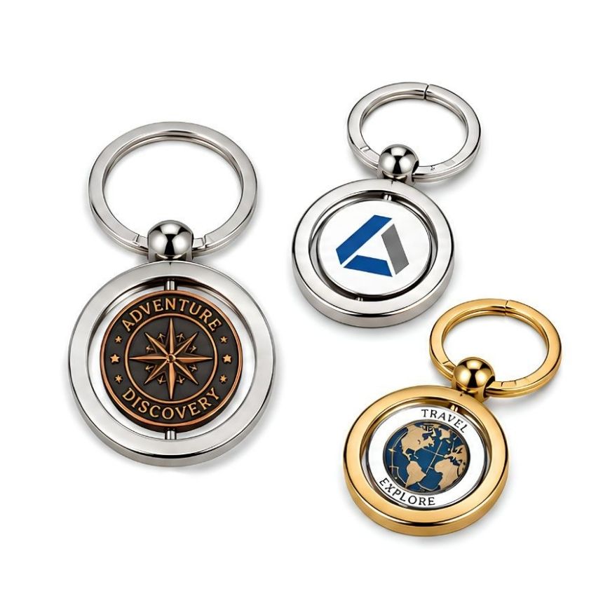 Custom round metal spinning keychains in silver and gold finishes, ideal for corporate promotional gift wholesale.
