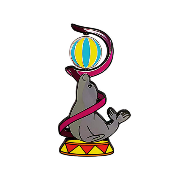 spinning enamel pins a seal playing a ball