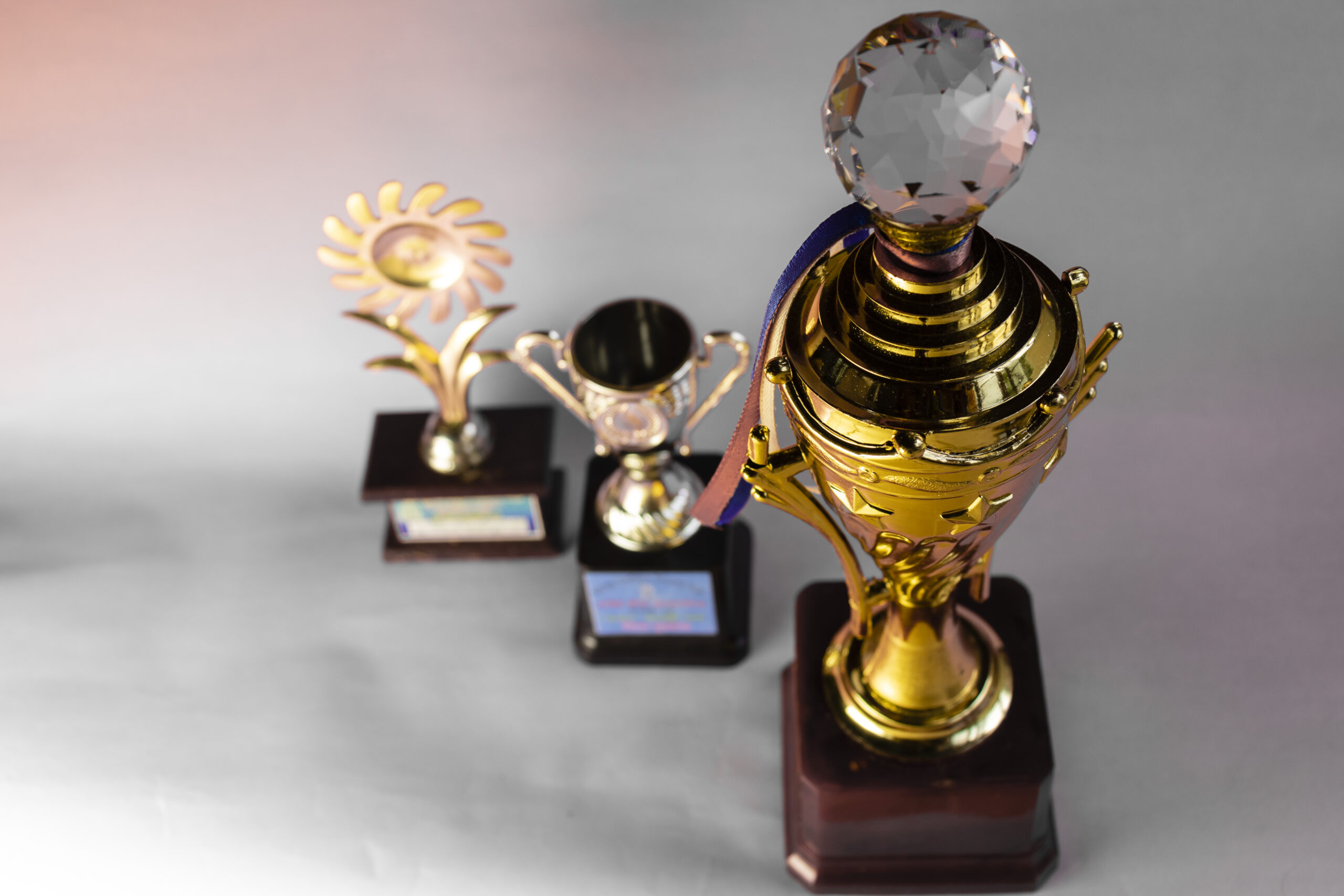 Trophies made with various designs and materials.