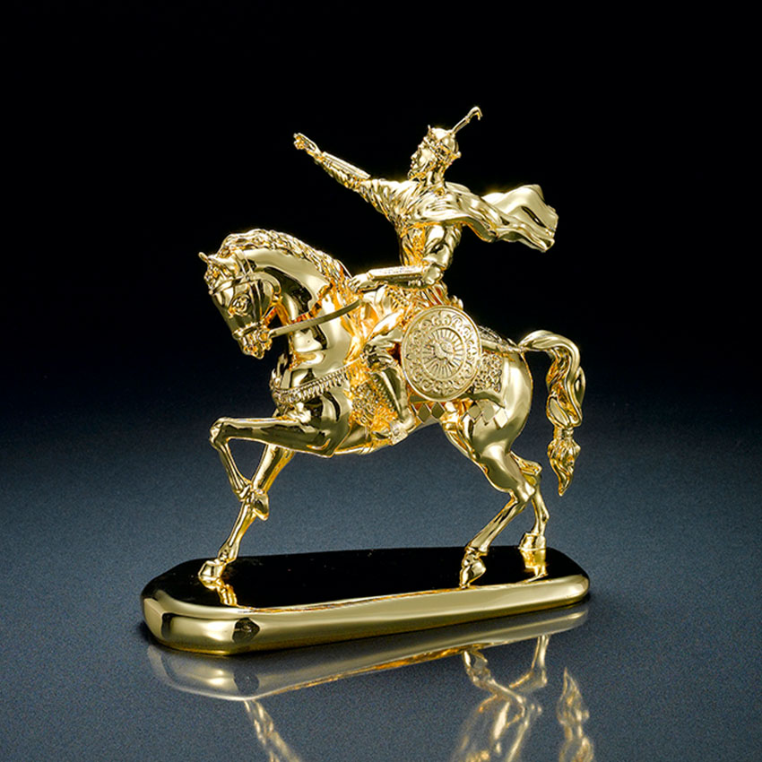 An intricate custom trophy by Jin Sheu featuring a warrior riding a horse.