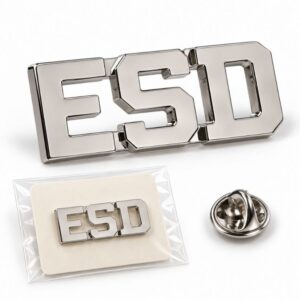 Custom silver nickel ESD monogram logo pin with clutch back and packaged retail card for corporate staff.
