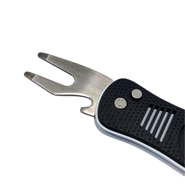 a black foldable golf divot tool with bottle opener