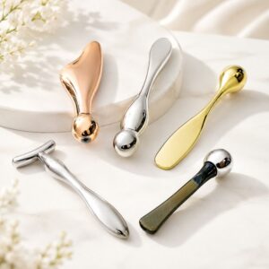 Set of premium metal skincare massage tools for eye rolling, facial lifting, and beauty treatments.