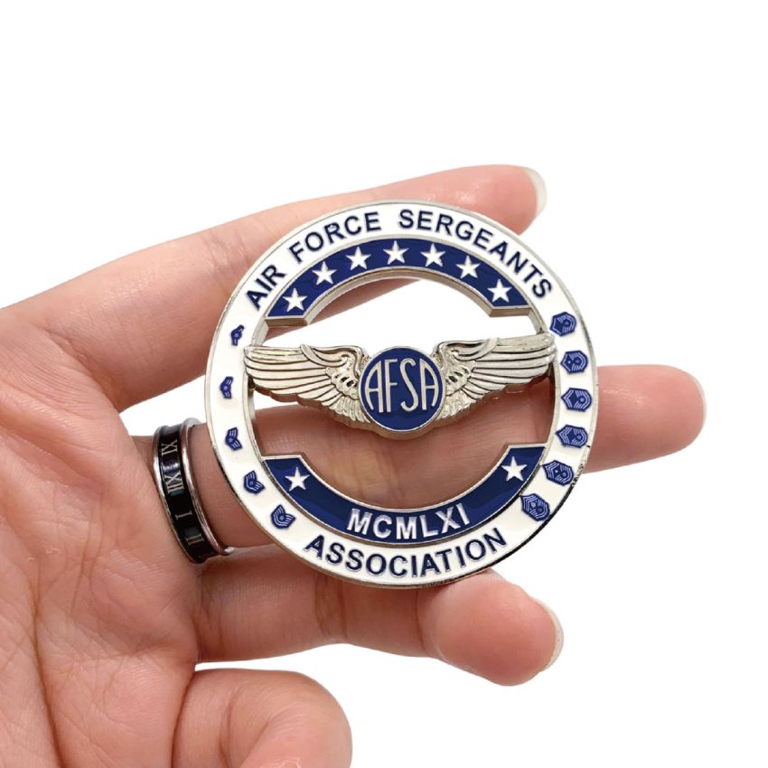 Handheld view of custom Air Force Sergeants Association challenge coin, showcasing the AFSA emblem and military ranks.