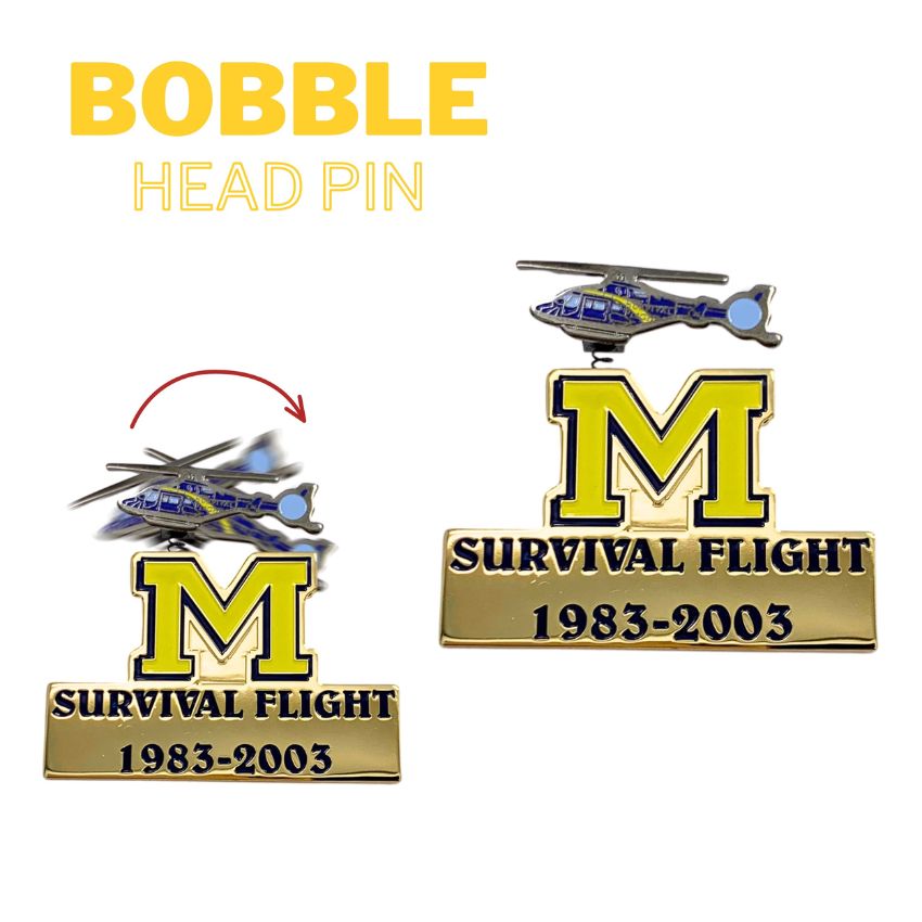Custom anniversary lapel pin with spring-mounted helicopter bobble action for corporate branding.