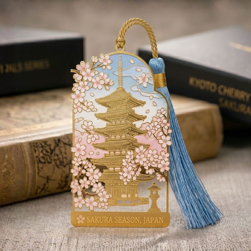Kyoto pagoda metal bookmark with tassel, crafted with transparent soft enamel and UV printed cherry blossoms.