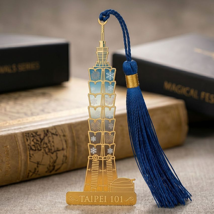 Taipei 101 metal bookmark with blue tassel, crafted with translucent soft enamel and UV printed fireworks.