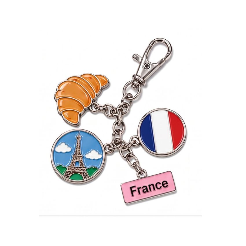 Custom France themed enamel charm keychain featuring Eiffel Tower, croissant, French flag, and metal clasp wholesale.