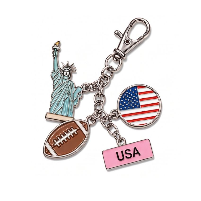 Custom USA themed enamel charm keychain featuring Statue of Liberty, American football, flag, and metal clasp wholesale.