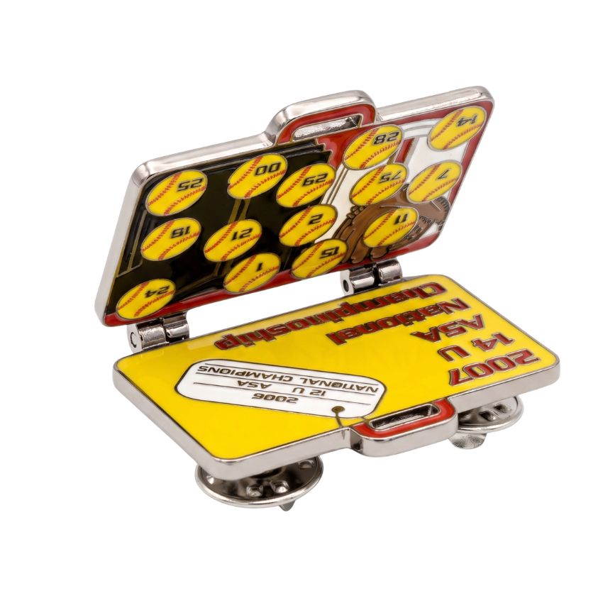 Fully opened custom hinged lapel pin displaying detailed softball graphics and championship text interior.