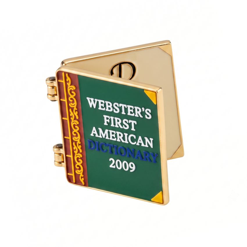 Custom book-shaped hinged enamel pin featuring Webster's Dictionary cover design and gold plating finish.