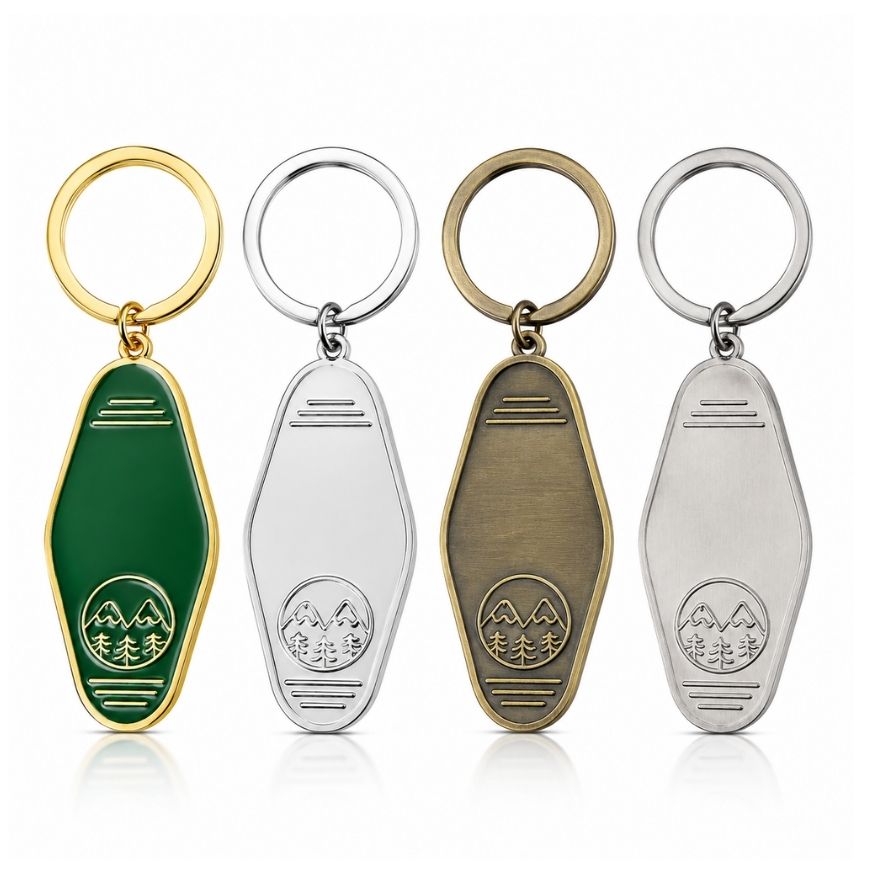 Custom blank metal motel keychains in gold, silver, antique bronze, and antique silver finishes for hotel key tag supply.