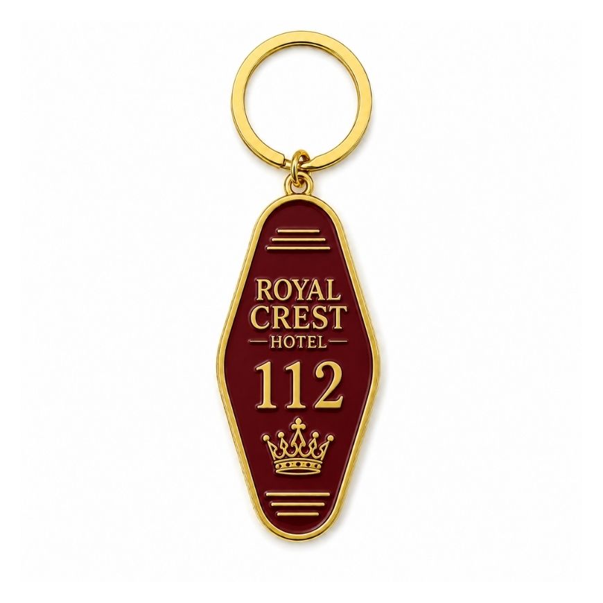 Custom burgundy enamel motel keychain with gold plating and crown logo, customized for luxury hotel room keys.