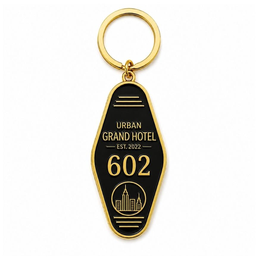 Custom black enamel vintage motel keychain with gold skyline logo for boutique hotel branding supply.