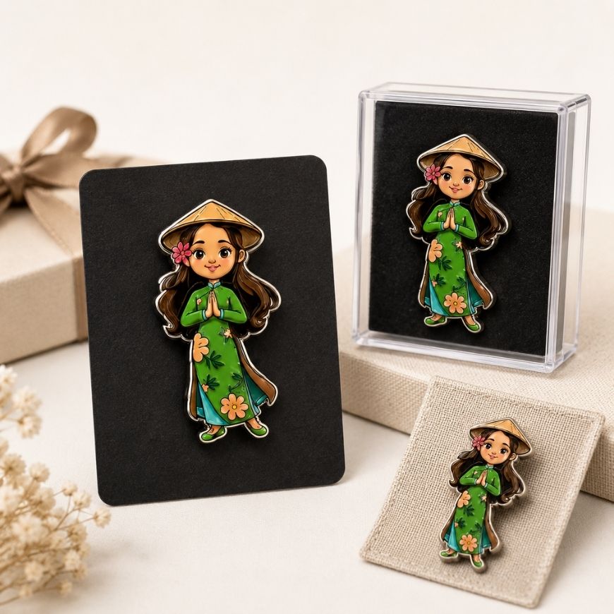3D printed custom lapel pins featuring intricate character designs, presented in clear acrylic display boxes and on backing cards.