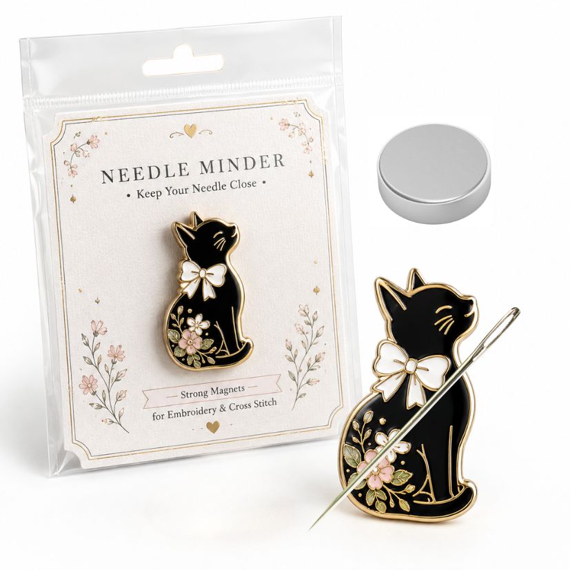 Black cat enamel needle minder with bow in retail card packaging and backing magnet, custom embroidery notions.