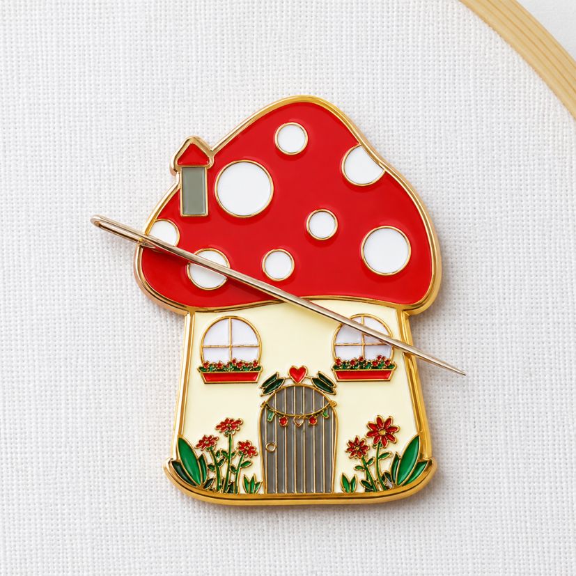 :Red mushroom house enamel needle minder securing an embroidery needle, wholesale magnetic sewing notions.