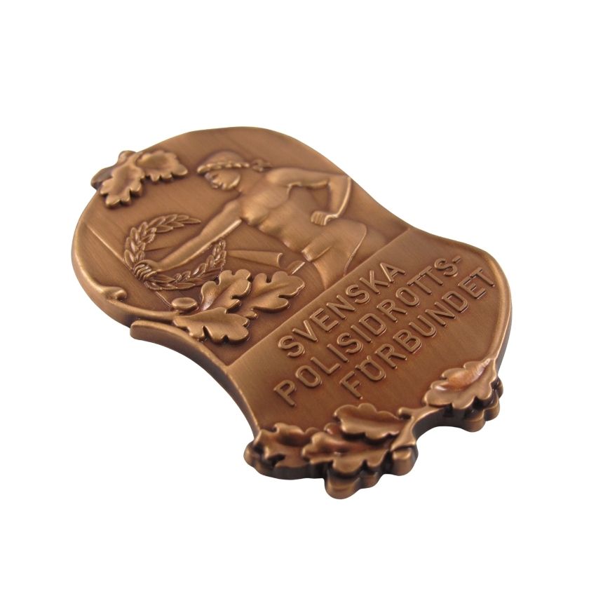 Custom 3D antique bronze shield challenge coin with embossed athlete relief, ideal for police awards wholesale.